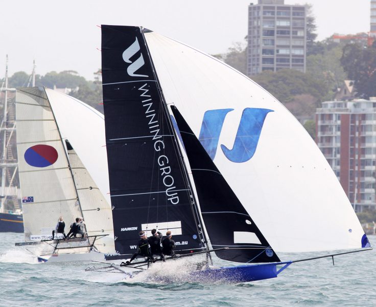 A battle of father and son as John Winning Jr's Winning Group leads John Winning's Yandoo down the long spinnaker run from Rose Bay to Kurraba Point