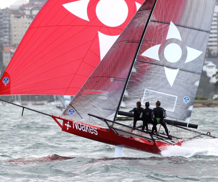 Sean Langman drives Noakesailing downwind in a Nor-Easter on Sydney Harbour