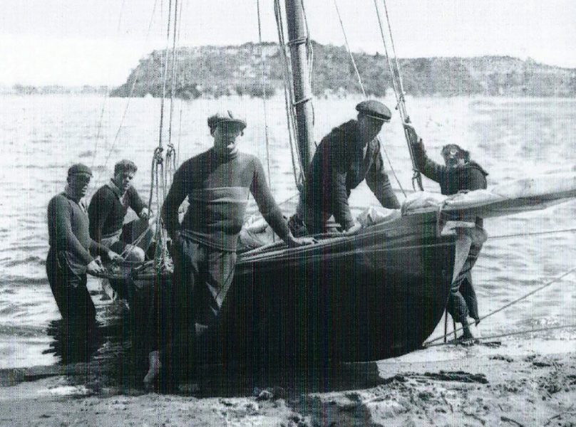 Sid Barnett Jnr (second from left) skippered Argo in 1932-33, Bill Barnett's father Prince is in the cap in front of the mast (archive)